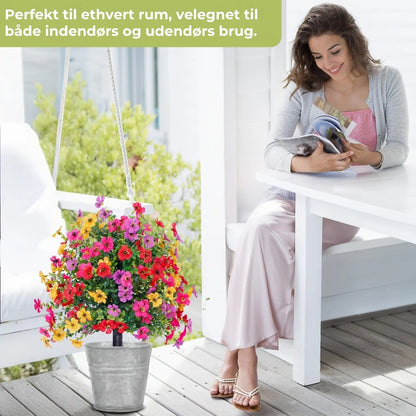 Blomsterdekoration med kunstig eukalyptus og violer