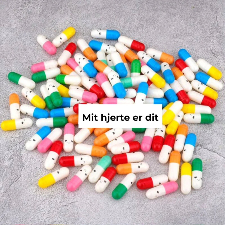 Kapsler med besked i gaveflaske
